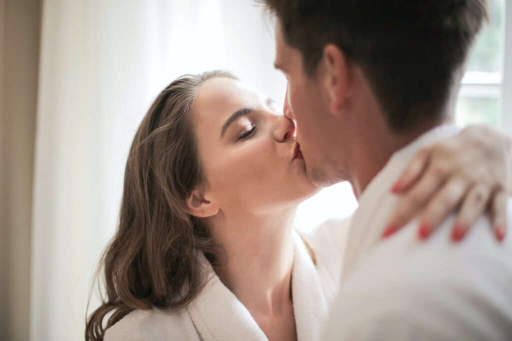 Man and Woman Kissing Each Other